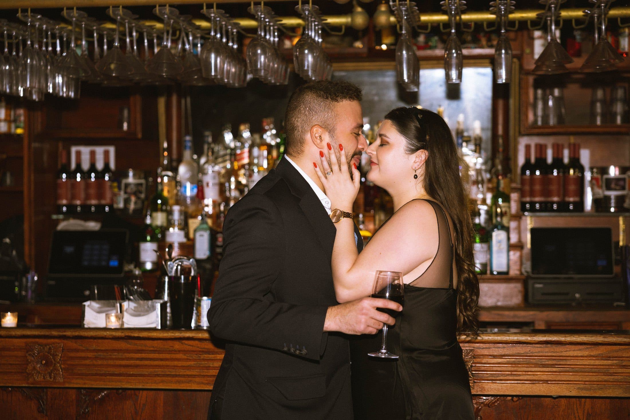 Rodolf and Lexie kissing at the bar after the proposal